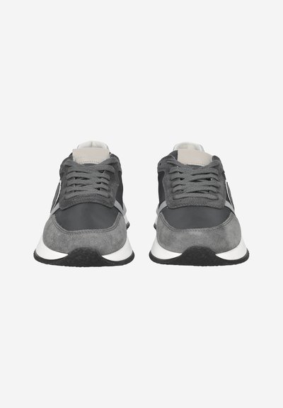 Pair of gray and black lace-up sneakers with white soles, viewed from the front on a plain white background.