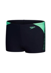 Pantaloni da nuoto neri con un accento verde sulla vita e sul lato. Realizzati in materiale elasticizzato, presentano una consistenza liscia e il logo Speedo.