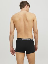Schwarze Baumwoll-Boxershorts mit elastischem Bund, der das "JACK & JONES"-Logo ziert. Schlichtes Design, körpernahe Passform, glatte Textur.