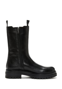 Black leather ankle boot with a side zipper, textured surface, pull tabs at the top, and a chunky rubber sole with tread for grip.