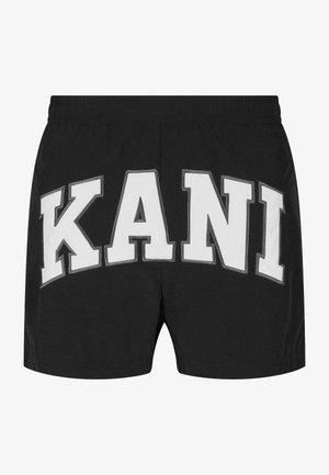 Mustad puuvillase kangast lühikesed püksid, mille ees on suur valge kiri "KANI", elastne vöökoht ja mugav disain.