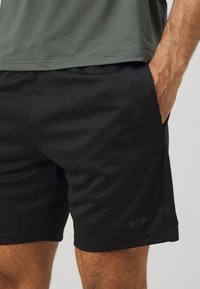 Björn Borg ESSENTIAL ACTIVE SHORTS - Calções desportivos - black beauty