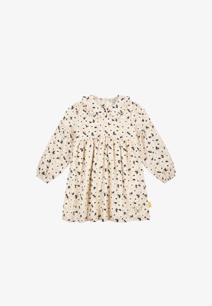 Vestido rosa claro con mangas largas, cuello redondo y cintura fruncida. Presenta un estampado floral en azul oscuro y crema. Etiqueta lateral destacada.