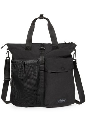 Black Eastpak tote bag with dual handles, adjustable shoulder strap, mesh front pocket, large flap pocket, and top zipper closure.