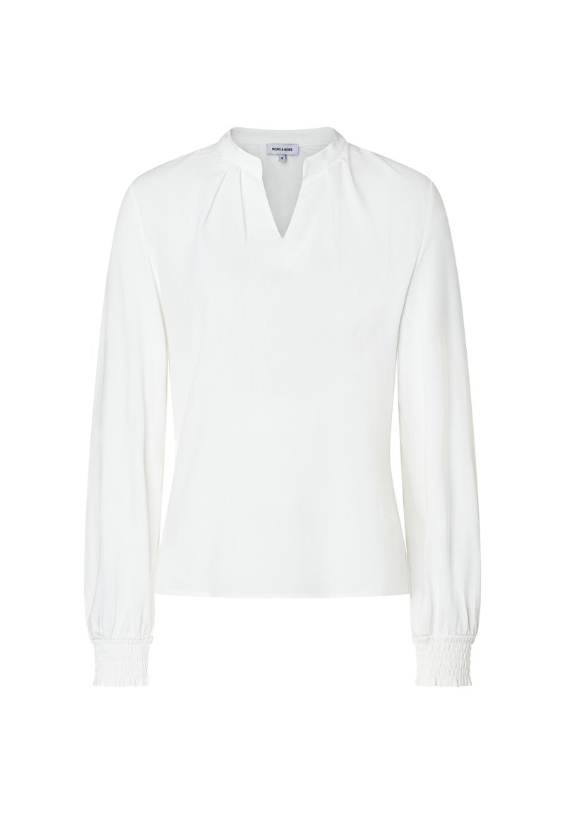 Weiße Bluse mit langen Ärmeln, V-Ausschnitt, gerafften Schulterdetails und gerüschten elastischen Bündchen.