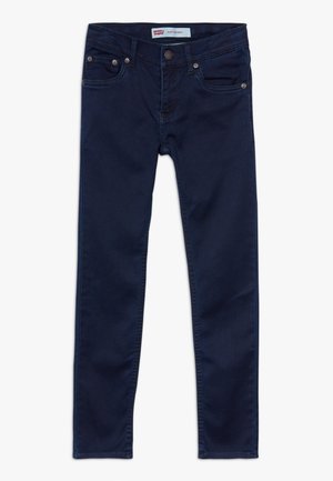 Dark navy skinny jeans made of soft denim. Features five pockets, a button closure, and subtle stitching details along the seams.