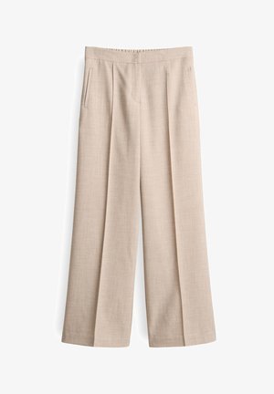 Pantalon large beige en mélange de lin texturé, avec des plis à l'avant et des poches latérales. Taille lisse, design ajusté.