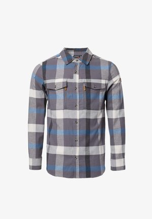 Chemise boutonnée à manches longues avec motif à carreaux bleu, gris, noir et blanc et deux poches poitrine à rabat avec boutons.