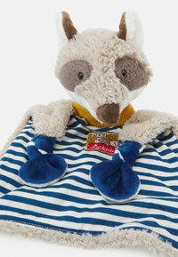 Plush comforter featuring a raccoon design, soft beige fur, and striped blue-and-white fabric. Includes blue paws and a label with animal graphics.