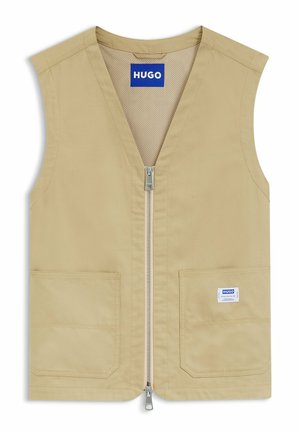Beżowa kamizelka bez rękawów z przednim zamkiem błyskawicznym, dwiema przednimi kieszeniami, niebieską metką "HUGO" na piersi oraz jedną na kieszeni, z siateczkową podszewką wewnętrzną.