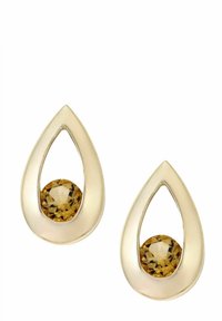 Örhängen i guldton i tårdroppeform med en central rund gul ädelsten som har en polerad yta och utskuren design för extra detaljrikedom.