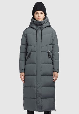Long, grey puffer coat with a hood, featuring a quilted design, front zip pockets, and drawstrings at the neck for adjustability.