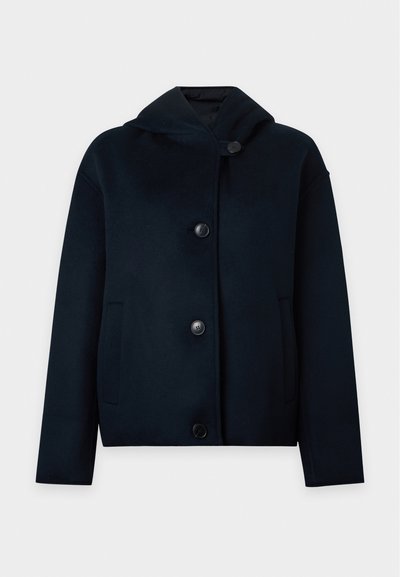 Veste en laine noire avec une capuche, manches longues, deux poches avant et quatre grands boutons sur le devant.