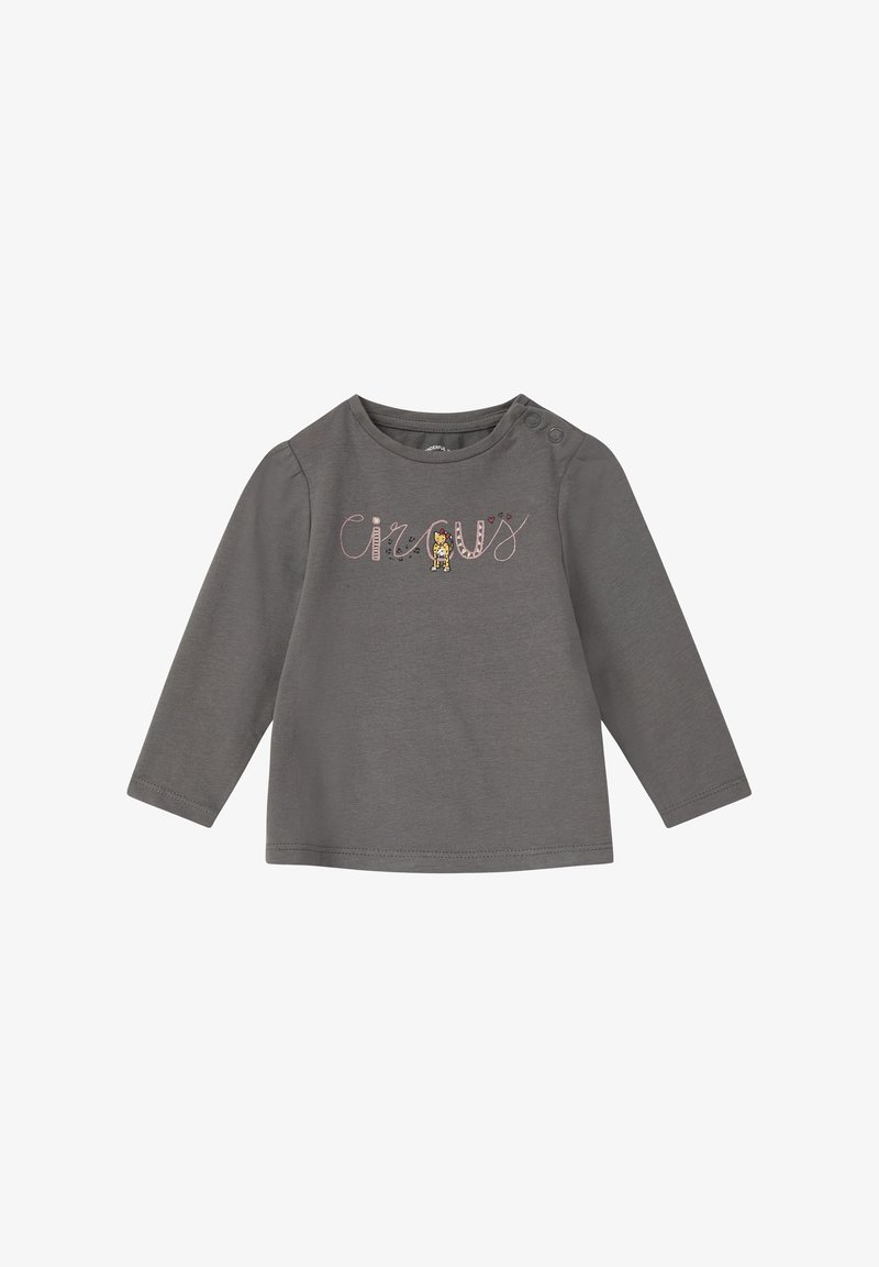 Grijze lange mouwen shirt van zacht materiaal met de tekst "circus" en een kleine leeuwafbeelding, met knoopaccenten op de schouder.