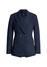 Blazer bleu marine taillé avec de larges revers, deux boutons dorés et des poches à rabat, conçu pour une silhouette ajustée.