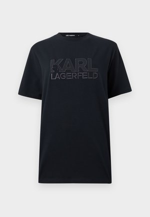 Camiseta negra de manga corta con gran texto en relieve "KARL LAGERFELD" y una pequeña silueta de perfil en el pecho.