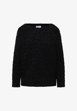 Sort langærmet top med struktureret leopardmønster. Blødt stof, rund hals og løs pasform. Mærkat synligt ved halsudskæringen.