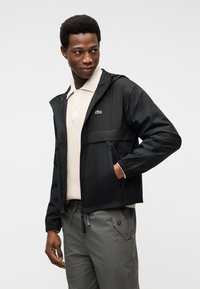 Lacoste Καλοκαιρινό μπουφάν - black