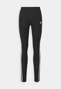 Zwarte leggings met een gladde textuur, voorzien van drie witte zijstrepen en een klein wit Adidas-logo op de voorkant van de taille.