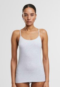 Lichtgrijze katoenen tanktop met dunne bandjes, met een slim fit en een zachte, gladde textuur. Geen zichtbare patronen of accenten.