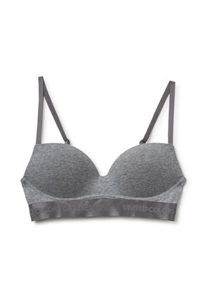 Sottogamma grigio imbottito con spalline grigie regolabili. Presenta una texture morbida e un band con logo in rilievo, progettato per comfort e supporto.