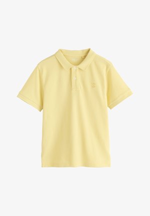Lysegul kortærmet poloshirt med to knapper og en lille broderet logo på venstre bryst.