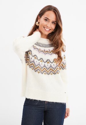 Maglione lavorato a maglia color crema con un collo decorato da un motivo a zigzag in grigio, viola e oro. Maniche lunghe e orlo a coste.