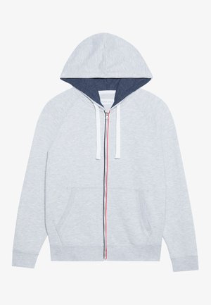 Light gray zip-up hoodie with a navy-lined hood, contrasting red and blue zipper accents, and two front patch pockets.