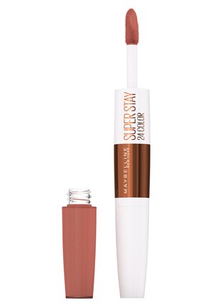 Maybelline Super Stay vloeibare lippenstift, met een lange, witte tube met gouden accenten, een zachte applicator en een rechthoekige roze verpakking.