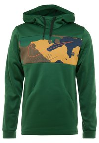 Sweat à capuche vert avec poche avant, arborant un motif camouflage jaune, marron et marine sur la poitrine avec un logo Nike Swoosh orange.