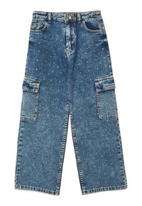 Pantalons en denim larges de couleur bleue avec des poches cargo et de petites clous en argent éparpillés sur tout le tissu.
