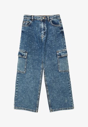 Pantalons en denim larges de couleur bleue avec des poches cargo et de petites clous en argent éparpillés sur tout le tissu.