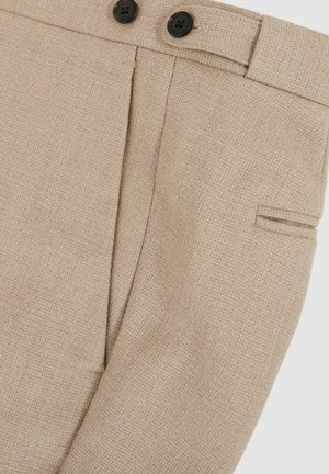 Beige tailored trousers with a textured weave, featuring two black buttons, a side pocket and a subtle pleat detail.