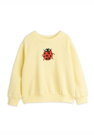 Lysegul langærmet sweatshirt med ribbede manchetter, kant og halsudskæring, med en rød og sort mariehøne broderet på brystet.