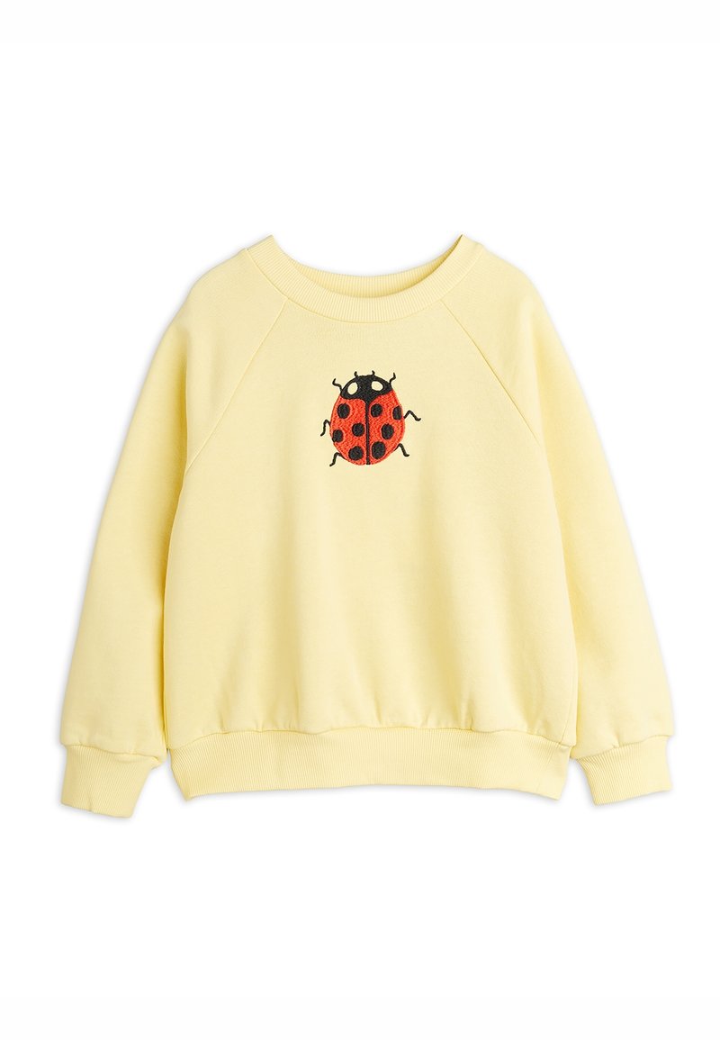 Sweatshirt jaune clair à manches longues avec poignets, ourlet et encolure côtelés, ornée d'une coccinelle rouge et noire brodée sur la poitrine.