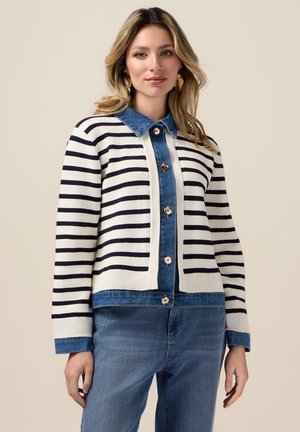 Striped cardigan with a blue denim collar and button placket, featuring horizontal navy stripes on a cream background and ribbed cuffs.