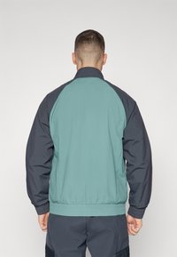adidas Performance FC BAYERN M�NCHEN SZN TRACK TOP - Squadra - dark grey/hazy emerald