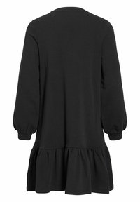 Robe noire à manches longues avec un col rond, un ourlet à volants froncés et une coupe décontractée. Confectionnée dans un tissu doux et extensible.