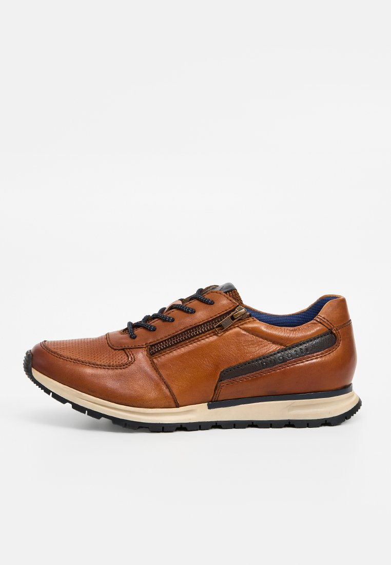 Brown leather sneaker with black laces, side zipper, black and beige sole, and blue inner lining, shown in a left side profile.
