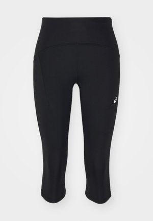Schwarze Capri-Leggings aus elastischem Material. Verfügt über einen hohen Bund, eine Seitentasche und ein kleines Logo auf der linken Hüfte. Glatte Textur.