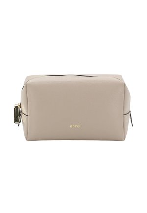 Beige rectangular leather toiletry bag with gold zipper and small gold logo on front center.