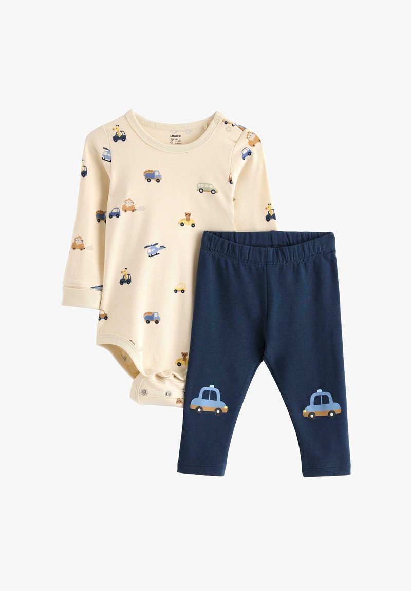Une combinaison beige clair avec des imprimés d'animaux et de véhicules, assortie à des leggings navy comportant des graphiques de taxi bleu. Matériau en coton doux, coupe ajustée.