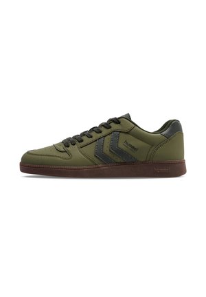 Dark green sneakers with a smooth texture, featuring black accents and a lace-up design. Brown rubber sole with logo detail on the side.
