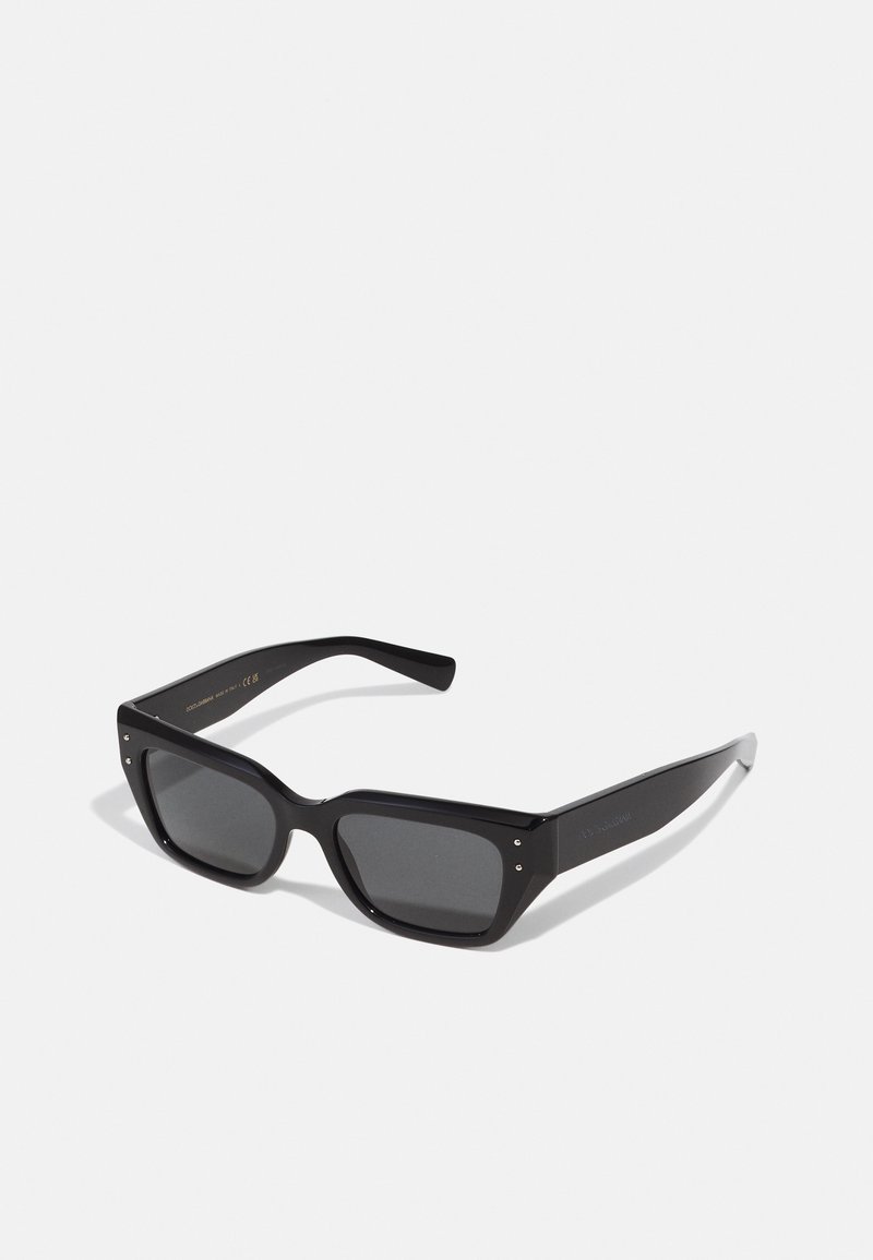 Black rectangular sunglasses with dark tinted lenses. Made of glossy plastic with a chunky design and metal accents on the sides.
