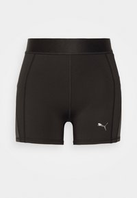 Pantalones cortos deportivos negros hechos de una tela elástica, con una textura suave, una cinturilla ancha y un pequeño logo plateado en la parte inferior izquierda.