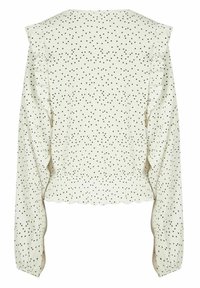Witte blouse met zwarte stippen, lange mouwen, ruches langs de schouders en een gekartelde zoom. Textuurstof.
