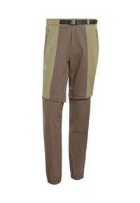 Εξωτερικό παντελόνι στενής γραμμής με σχέδιο σε μπεζ και καφέ χρώμα, ελαστικές μανσέτες, ρυθμιζόμενη μέση και πολλαπλές τσέπες με φερμουάρ.