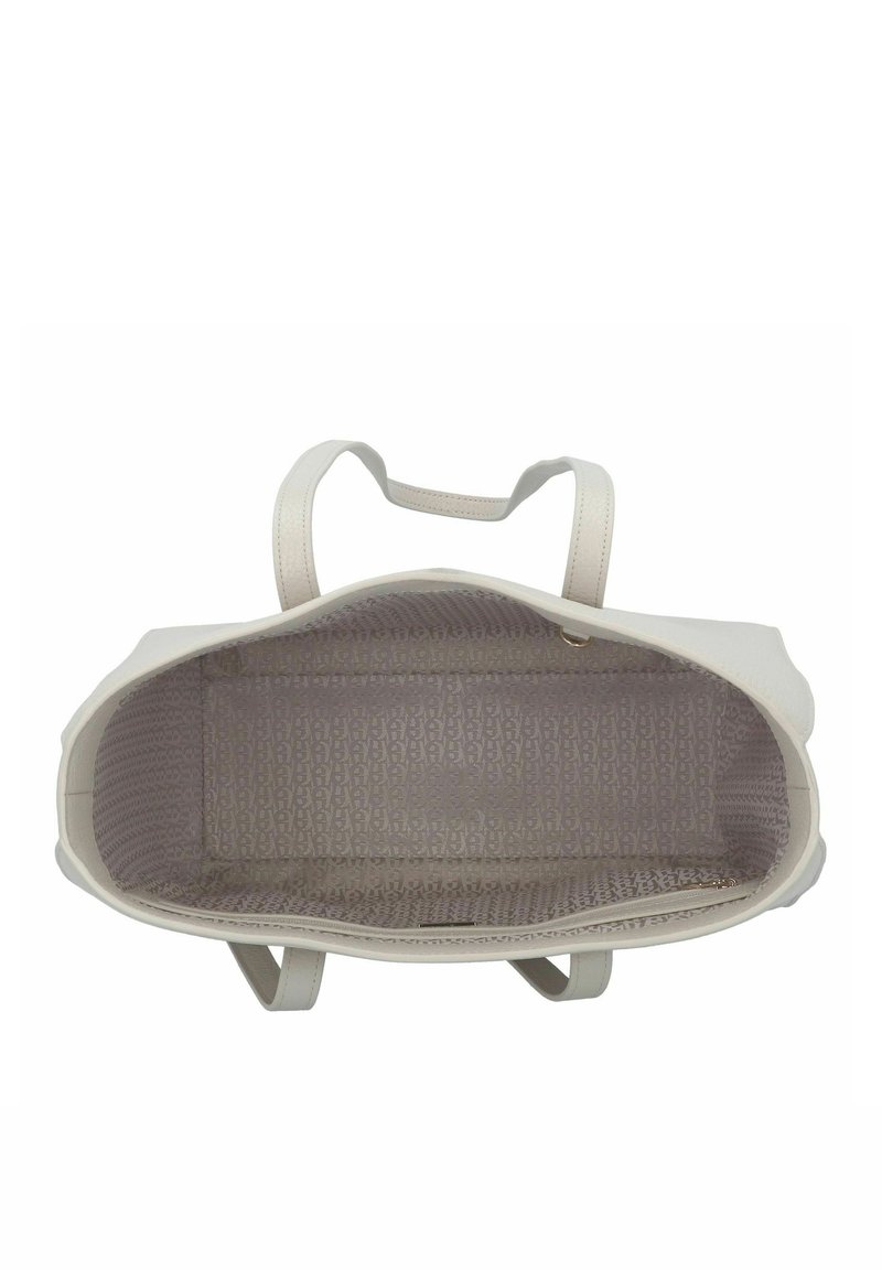 Weißes Tote Bag mit doppelten Henkeln, das ein gemustertes Innenfutter in hellem Beige aufweist. Glatte Außenseite ohne sichtbare Beschläge.