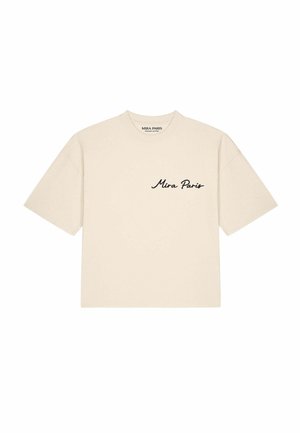 Beige T-shirt met korte mouwen en ronde hals en zwarte "Mira Paris" tekst op het linker borstgebied.
