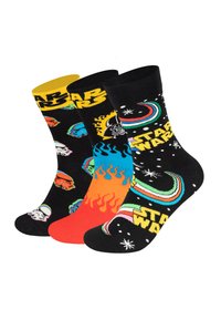Trois paires de chaussettes avec des bases noires présentant des graphismes colorés de Star Wars, incluant des personnages et des motifs en jaune, bleu et orange.